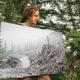 AFA photographer TJ Watt shows a print of his photo of a man on a stump in the Gordon River valley that won first place in a Outdoor Photography Canada magazine photo contest.